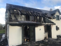 Back of house with fire damage